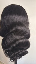 Close-up of glossy natural black body wave human hair, 26 inches