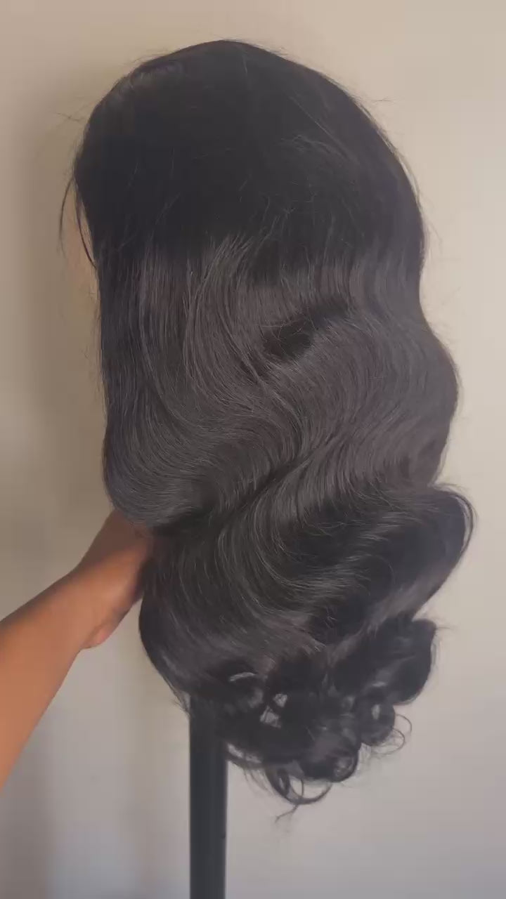Video of the 26 inch body wave human hair wig showing movement and bounce